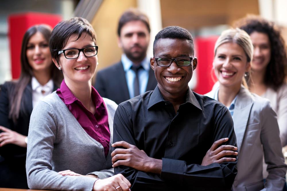 Multicultural group of professionals posing for the camera