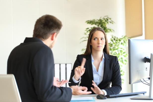 Candidate responding to hiring manager's low salary offer by waving her finger