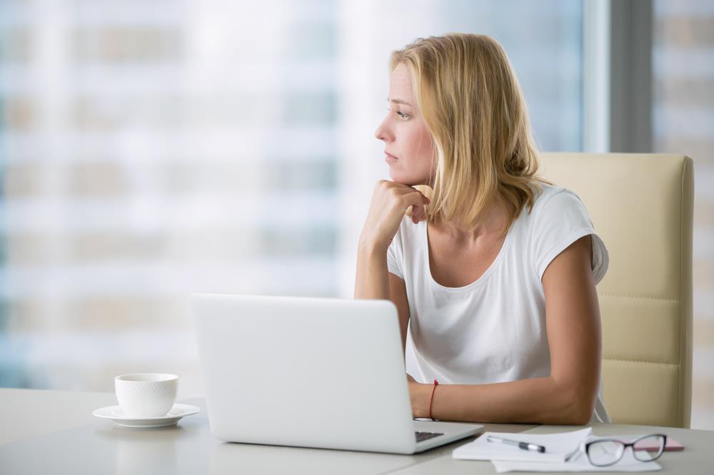 Blonde woman bored at work