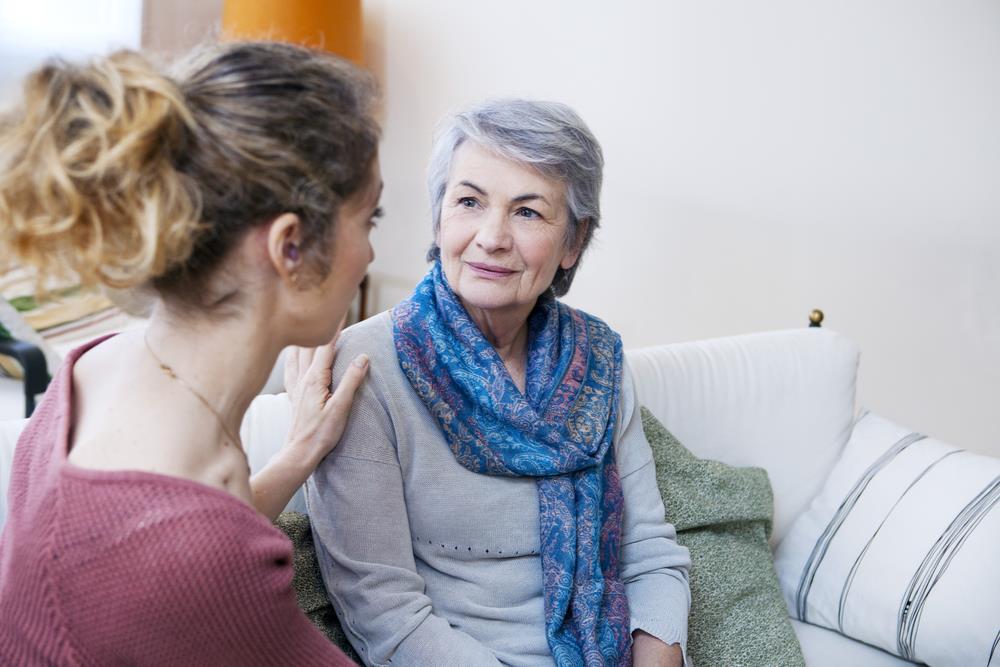 female social worker meeting with elderly woman