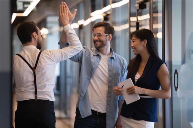 Coworkers high fiving