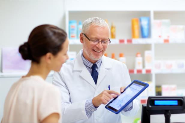 pharmacist assisting patient