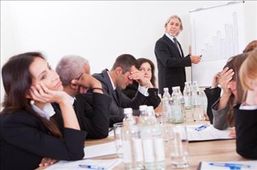 Group of professionals falling asleep in meeting and showing company's employee disengagement problem