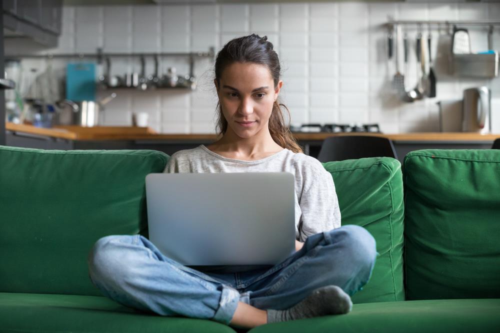 Woman preparing her computer for a video interview