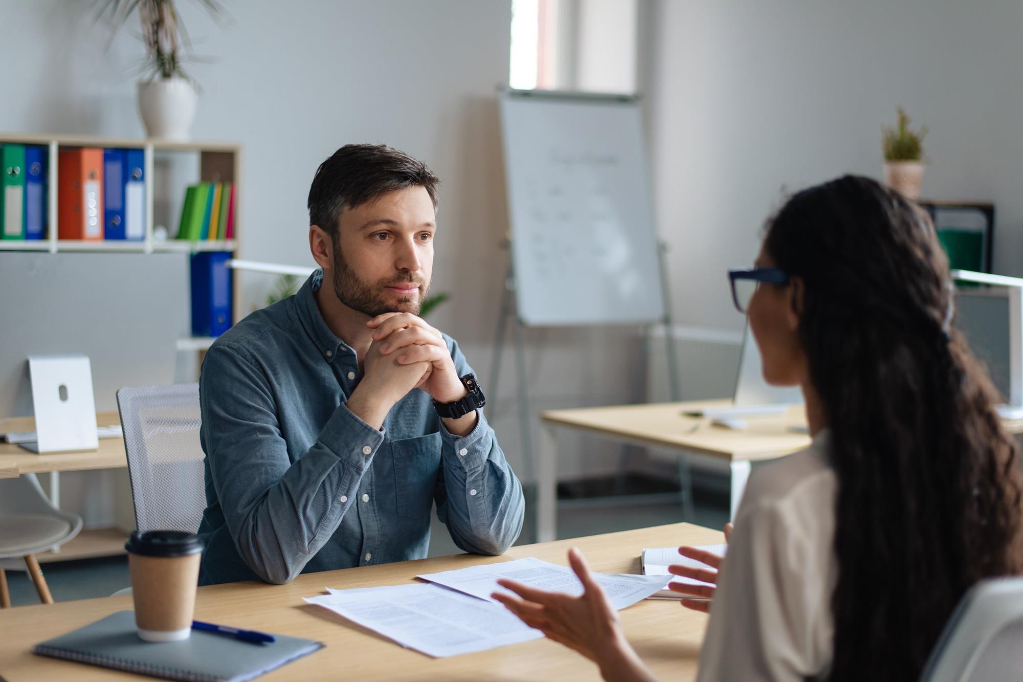 interviewer listening to a job candidate speak