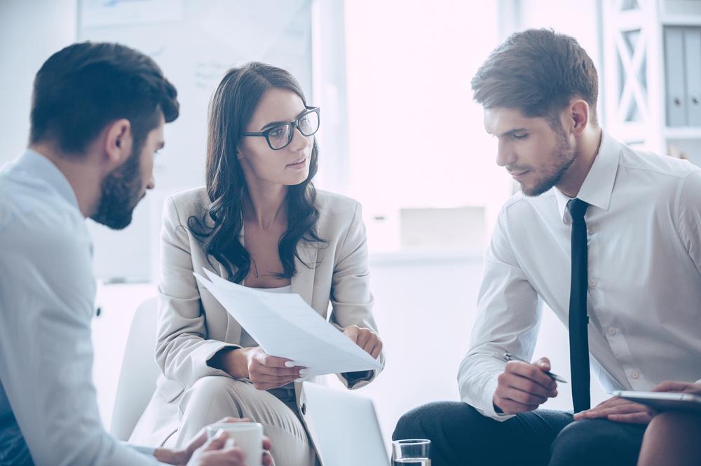 female interviewer showing a document to interviewee during an interview