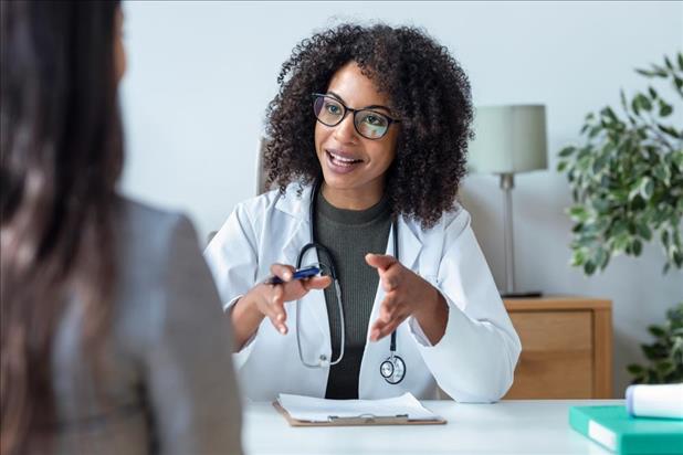 doctor interviewing a candidate in her office