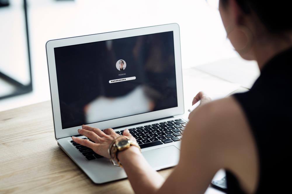 Recruiter entering a password to access the social media profile of a candidate