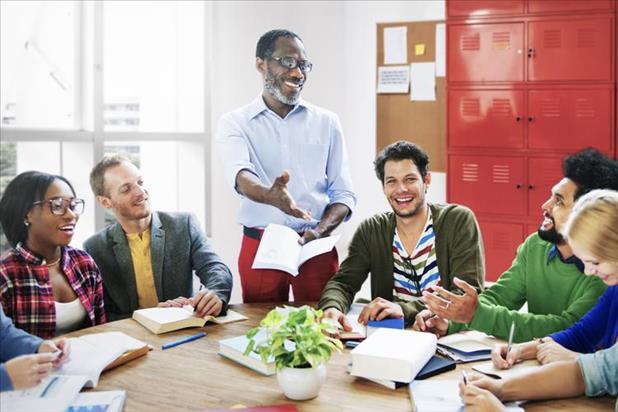 school principal having a meeting with a group of teachers