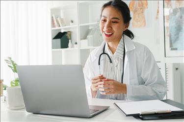 doctor interviewing a candidate virtually via her laptop