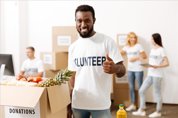 Volunteer giving a thumbs up