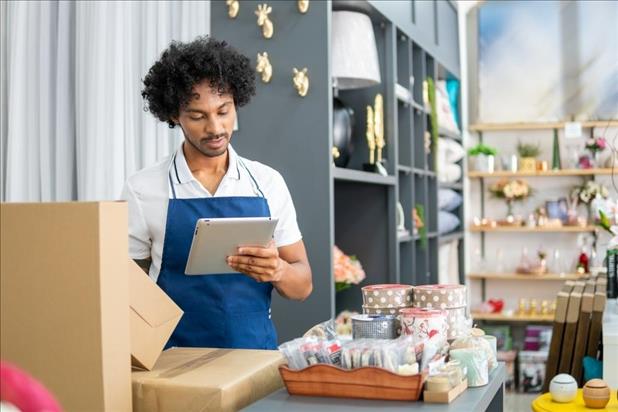 seasonal retail employee using an ipad