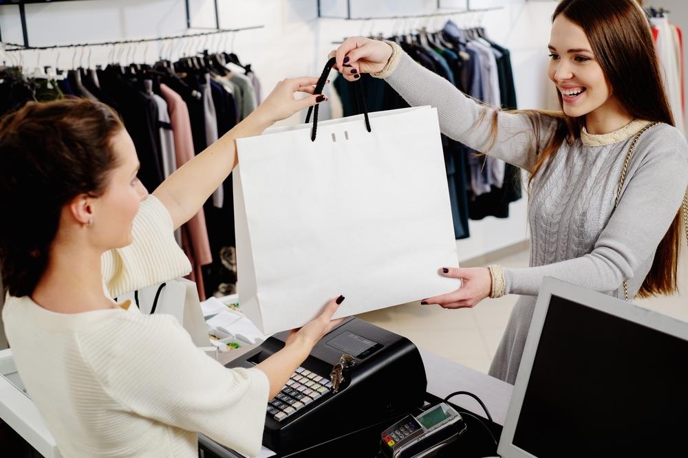 woman checking out at a department store