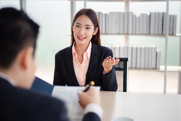 Woman talking to coworker