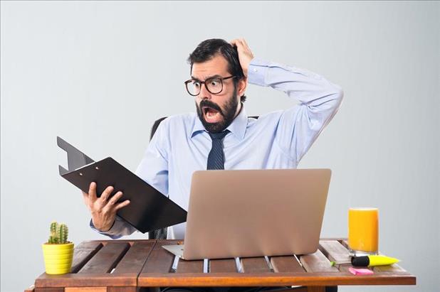 HR manager looking at resume in shock