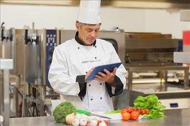 Sous chef in the kitchen reading resume writing tips