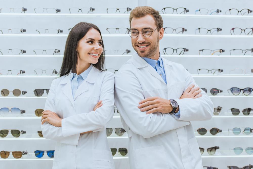 two optometry team members at work