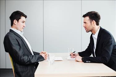 interviewer and interviewee in a stressful interview