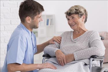 caregiving professional helping a patient