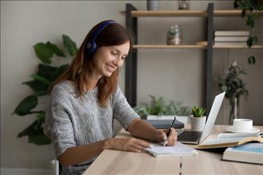 Woman working at home on laptop