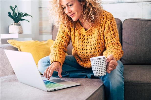 woman with colorful keyboard working on her resume