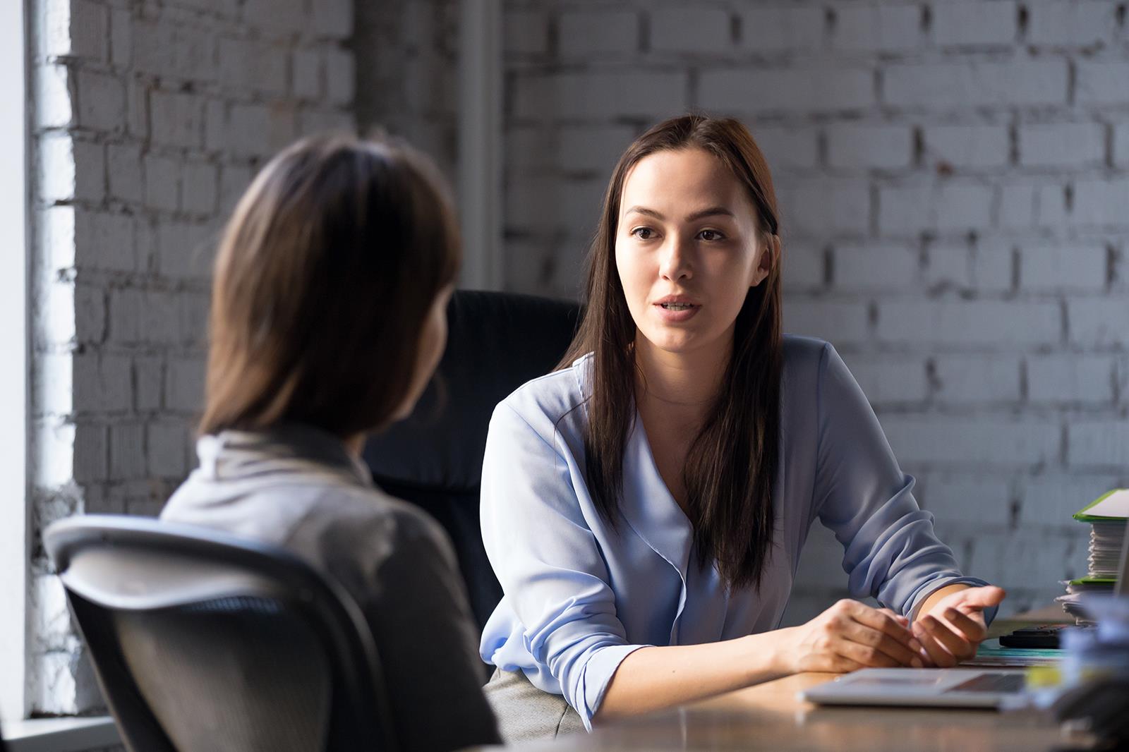 Woman conducting an interview with another woman