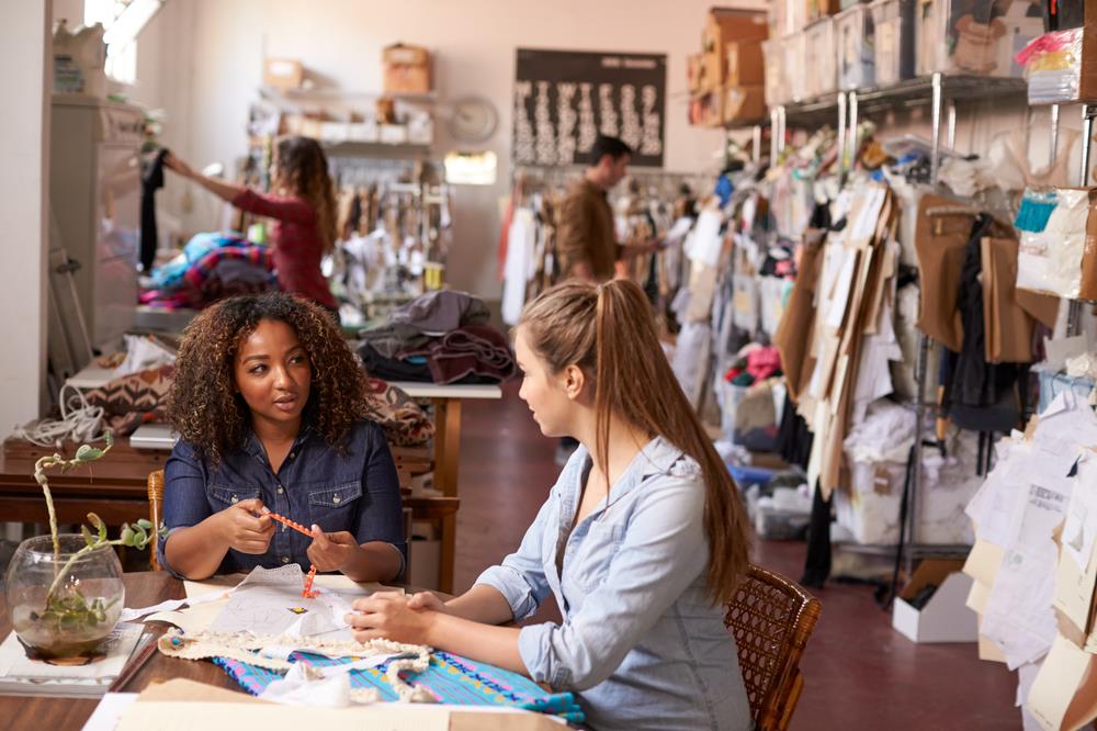 Team members discuss small business hiring plans