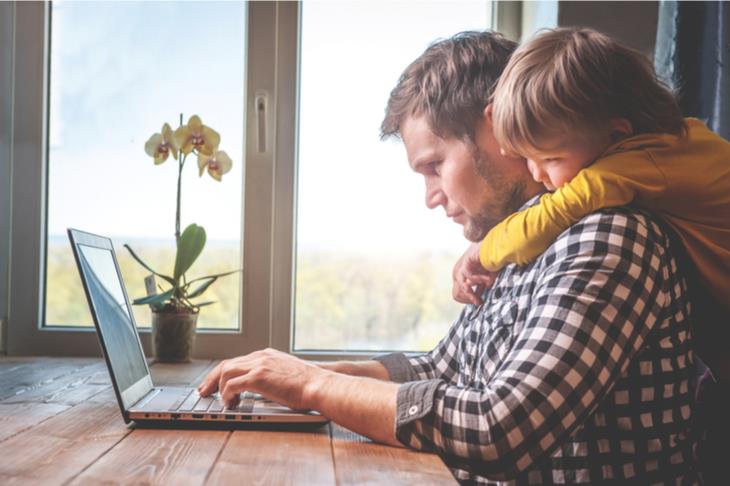 dad working from home with kid