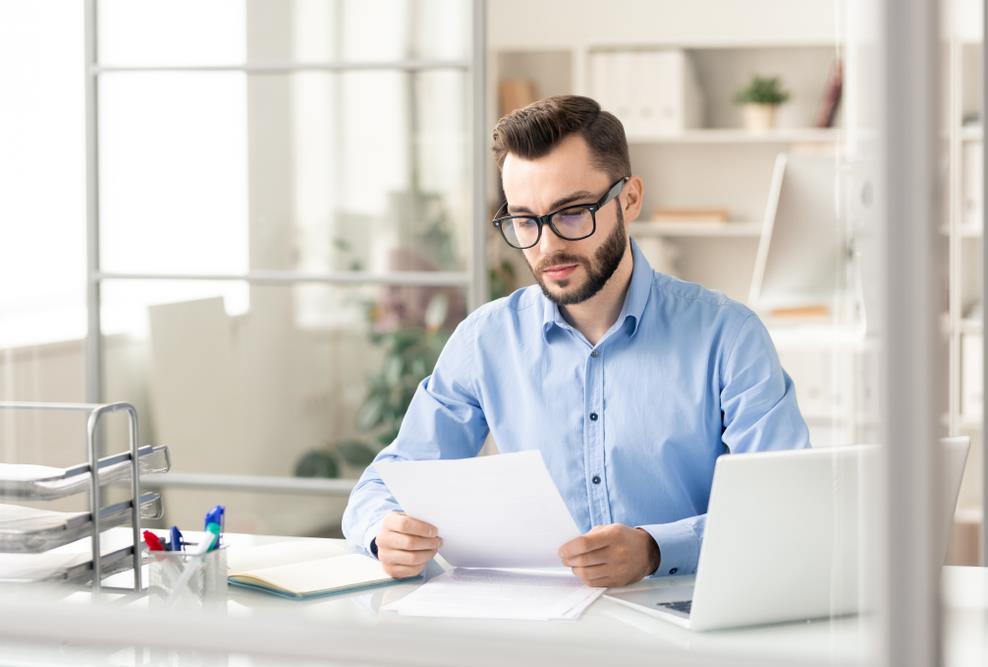 employee reviewing paperwork