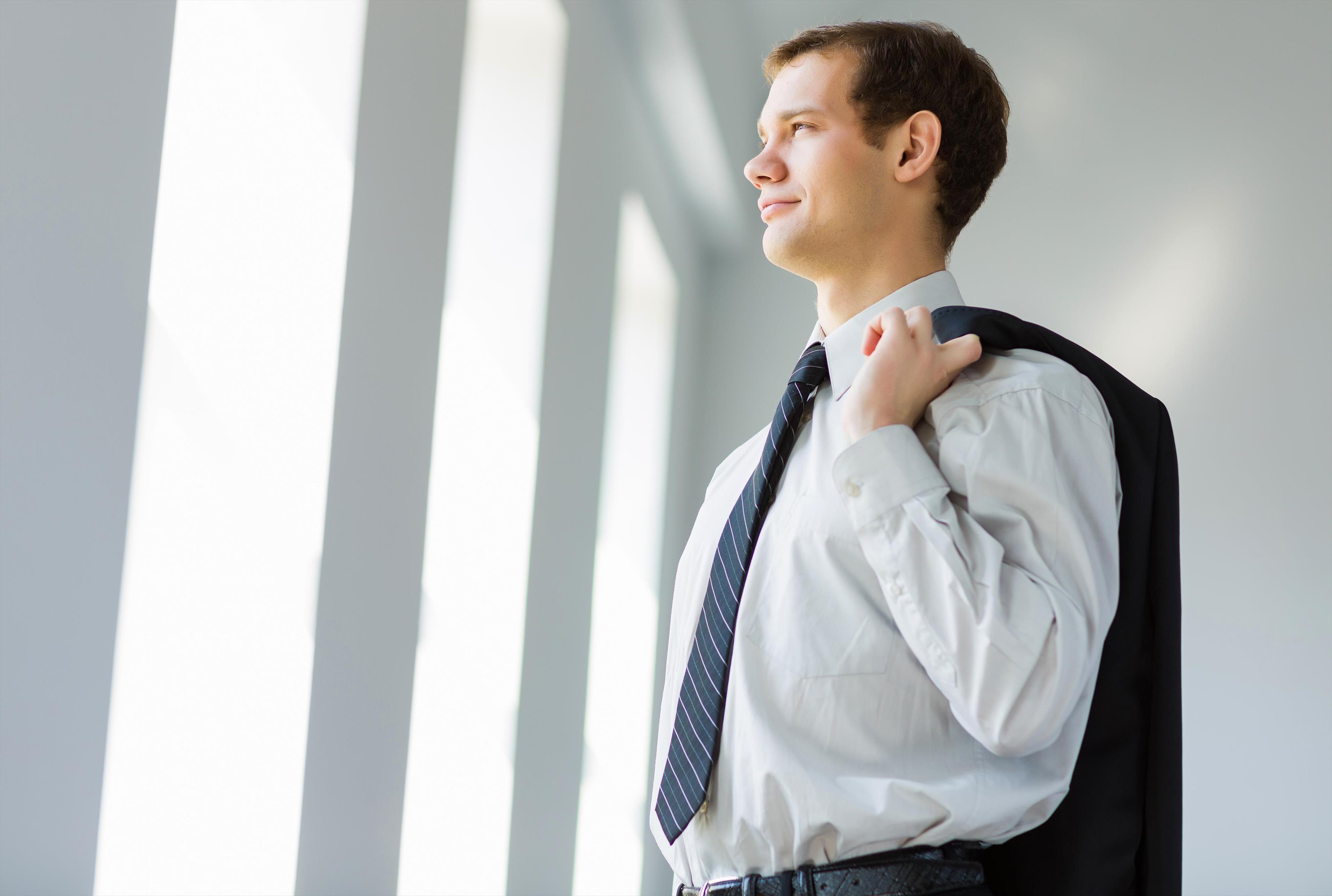 businessman holding jacket