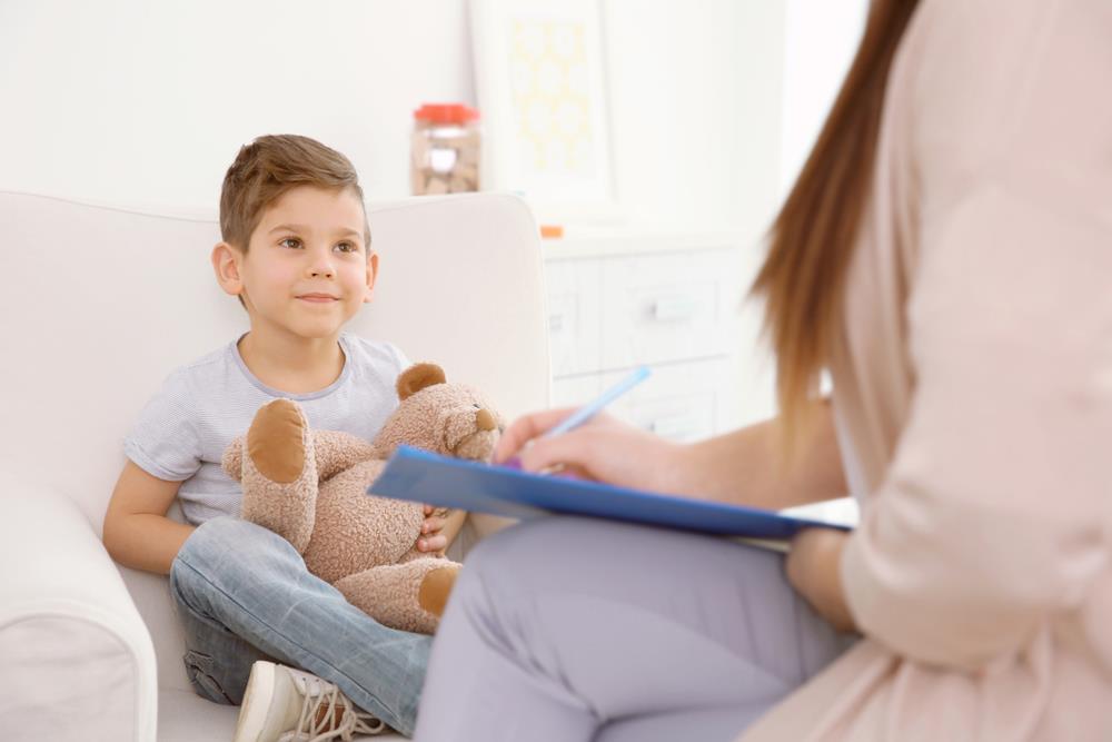 School psychologist meeting with young boy