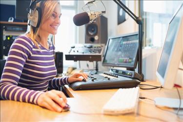 broadcasting professional at her desk