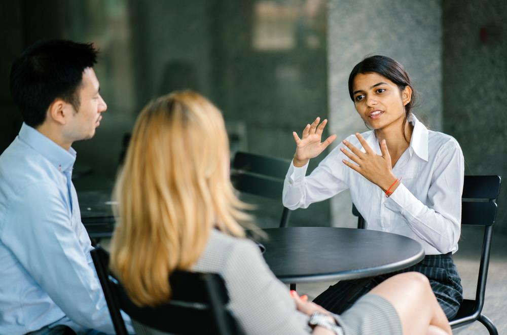 Woman explaining something during interview