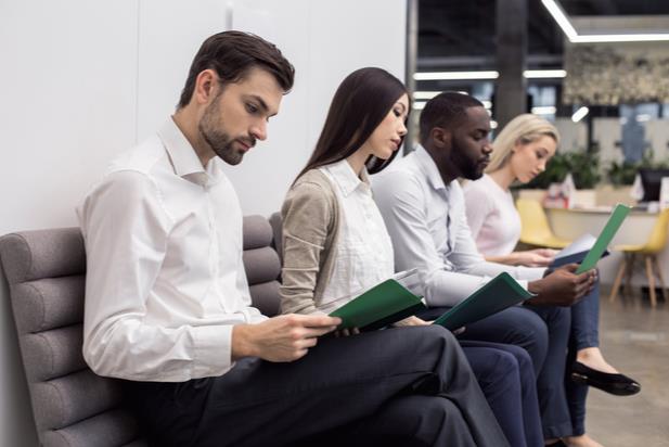 employees looking at documents