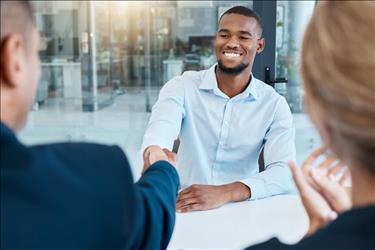 new employee shaking hands after accepting a job offer