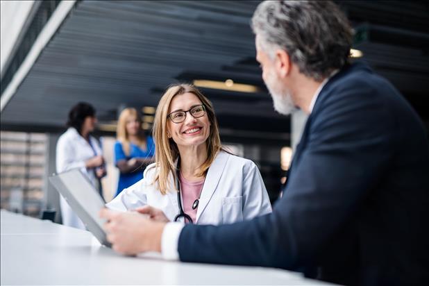 smiling doctor meeting with a job candidate