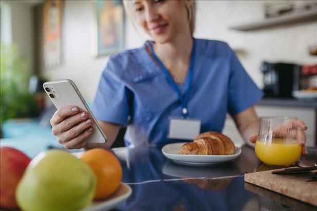 happy medical employee enjoying healthy food