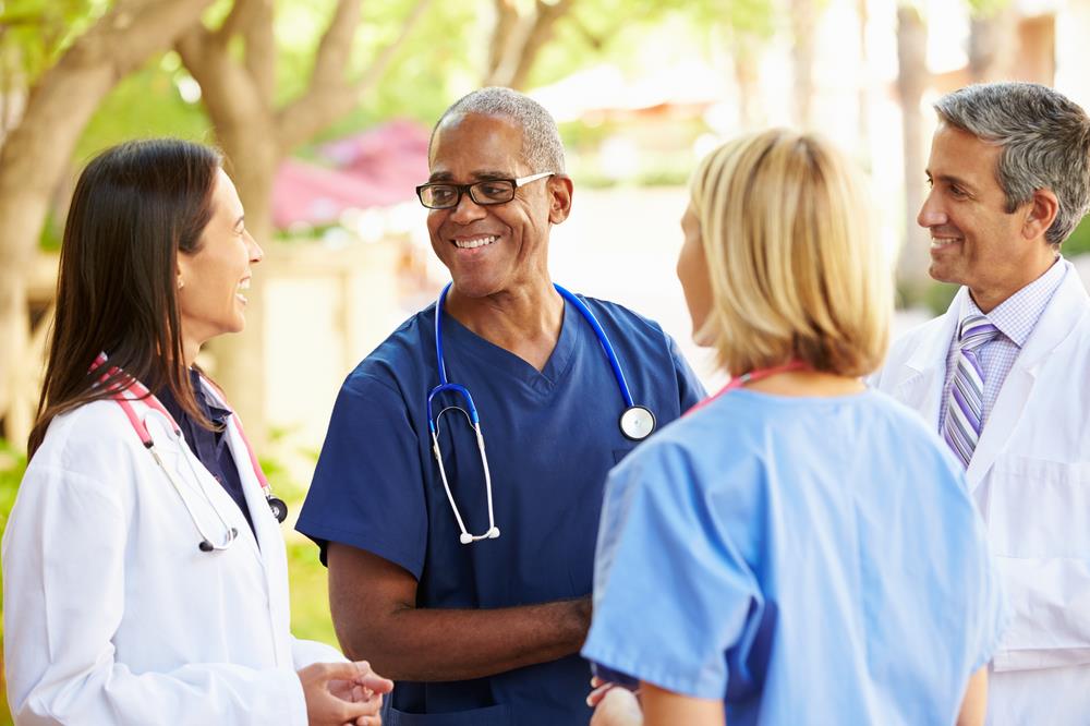 group of healthcare professionals meeting outside