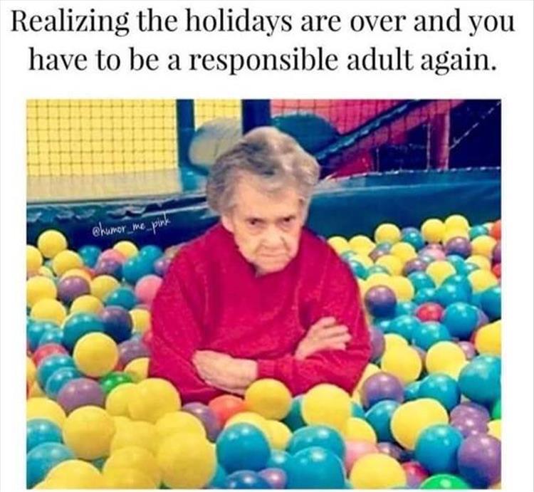 Old woman in ball pit frowning and crossing her arms