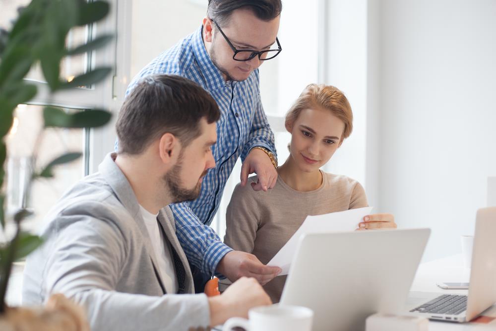 team members reviewing a job description for an opening at their company