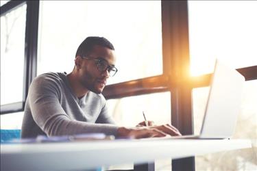 man working on laptop