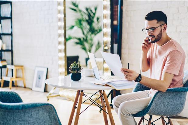 recruiter reviewing cover letter and calling candidate to schedule interview