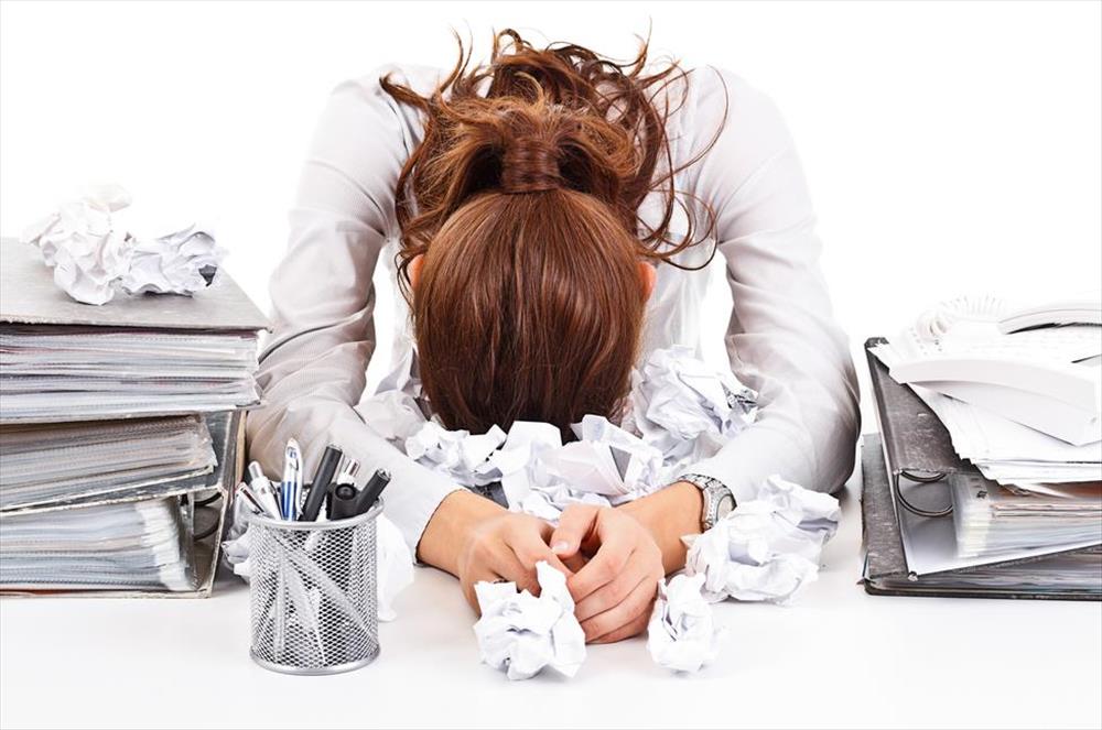 Woman with head on desk